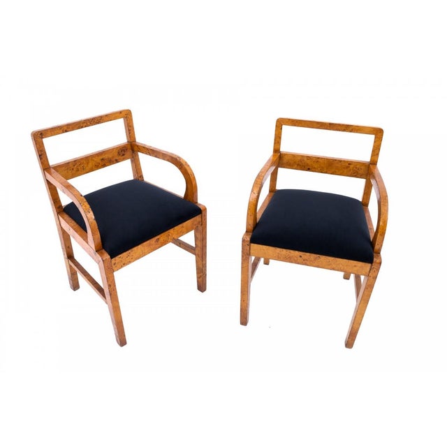 Discover this exceptional pair of elegant Art Deco armchairs, originating from Poland in the 1940s. Crafted from high-...