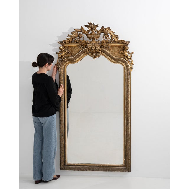 A mirror whose gold gilt ornate carved scrollwork gives it real character at first glance. The piece dates to 1880s,...