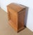 Small cabinet or medium desk from the 1900s. The facade of fitting in the tab frame has a large molding on all sounds...