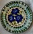 A large and unusually decorative Danish faience charger by Aluminia, Copenhagen, featuring a bold hand-painted floral...