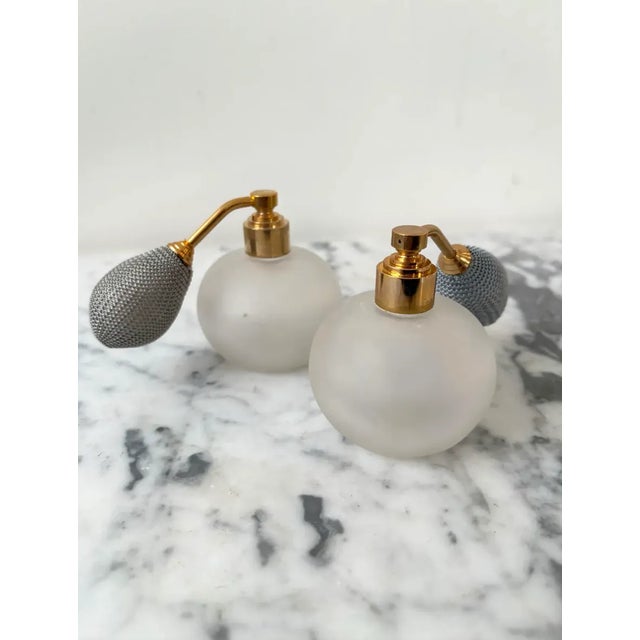 Beautiful, traditional perfume bottle set (2 bottles) made of frosted glass and brass. The bottles are complete with...