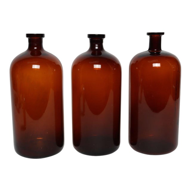 Set of Three Vintage Amber Glass Apothecary Bottles by Owens Illinois Glass Co. For Sale