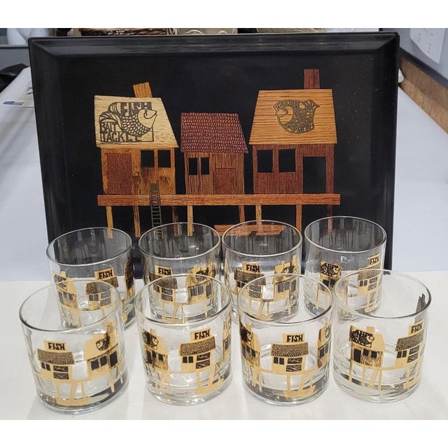 ✦ A signed Couroc of Monterey phenolic resin fish tray with a complete set of eight matching gold-decorated rocks glasses...