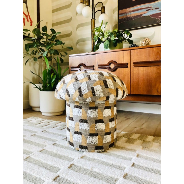 A handmade mushroom shaped ottoman, upholstered in "Oxido-Honey" specialty fabric. Oxido-Honey is a woven fabric with...