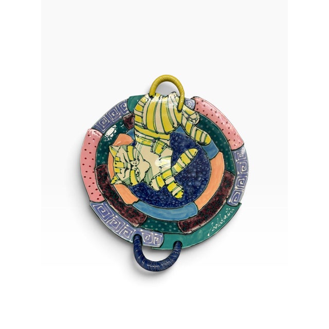A vibrant and whimsical vintage 1990s studio art pottery platter by Lithuanian-American artists Juozas and Rasa Saldaitis....