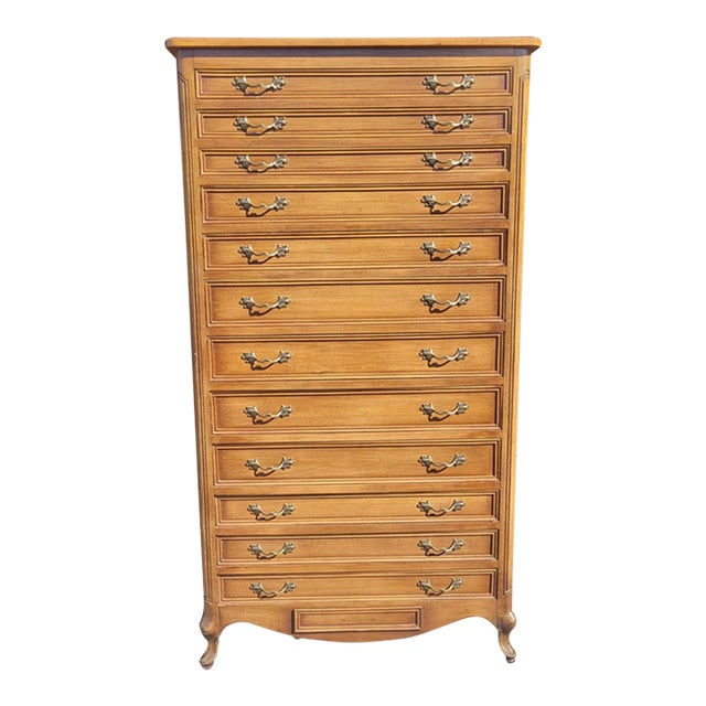 Fabulous and exceptional rare 12 drawer Plus a lower bottom hidden drawer French Walnut lingerie chest. Features 12...