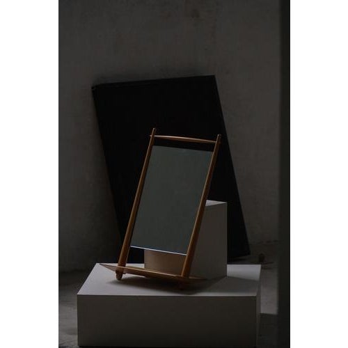 This elegant mirror is a fine example of Danish Mid-Century Modern design, dating from the 1950s–1960s. with its clean...