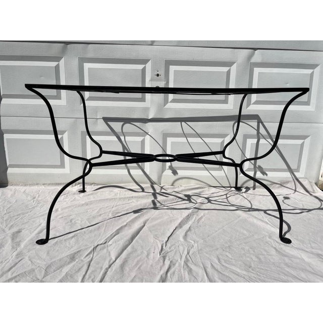 A single vintage rectangular metal outdoor dining table base featuring Salterini style accents including leaves and...