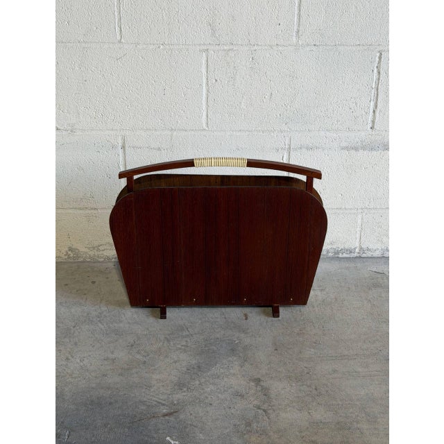 Crafted in Denmark, this elegant magazine holder showcases clean lines and rich teak wood grain. The minimal silhouette...