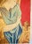 The mounted tapestry shows a maiden in a classic gown with rich surroundings. Colors are intense, red, gold, and shades of...