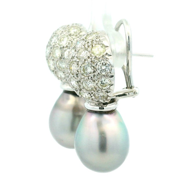 A sophisticated pair of diamond and South Sea pearl drop earrings, crafted in 18 karat white gold and designed with...