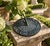 A classic vintage iron verdigris garden sundial inspired by traditional English estate landscapes, reading "Time Began in...