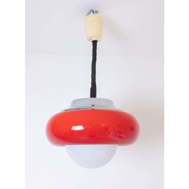 Red Jadran Pendant by Harvey Guzzini, in Flawless conditions. Designed 1970 to 1979 This piece is attributed to the...