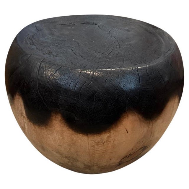 Reclaimed mango wood side table hand carved into an impressive drum shape. We partially stained the top half espresso and...