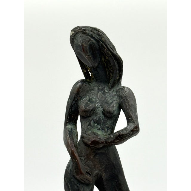 For your consideration: Stunning Brutalist bronze woman sculpture. Great patina. Sits on a wood base. Measurements include...