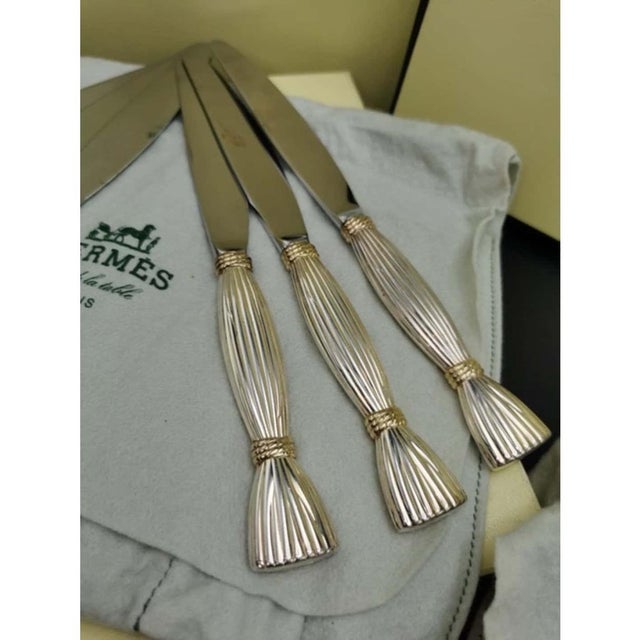 Hermes paris, "harvest" flatware set by christofle, silversmith, 82 pieces: part of a silver-plated and gold-plated...