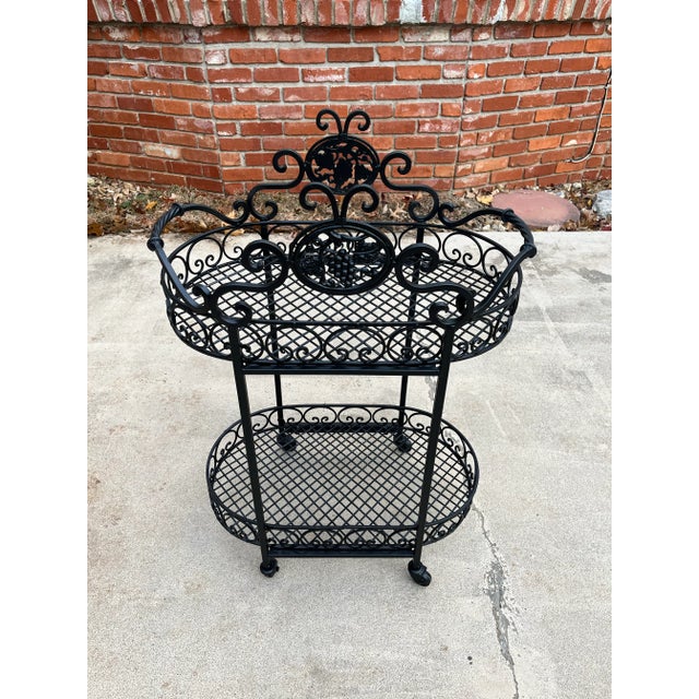An excellent two-tiered vintage bar cart in fantastic condition. Newly repainted with exterior grade paint to restore...