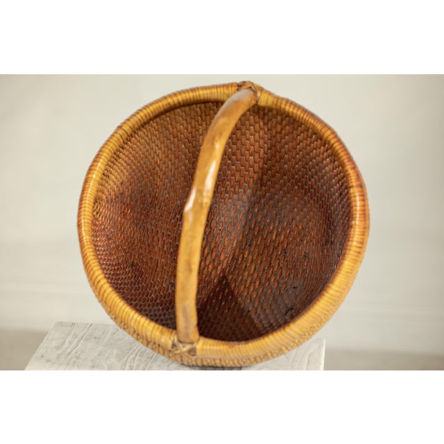 Vintage Chinese Handwoven Rattan Carrying Basket with Arched Handle For Sale - Image 13 of 18