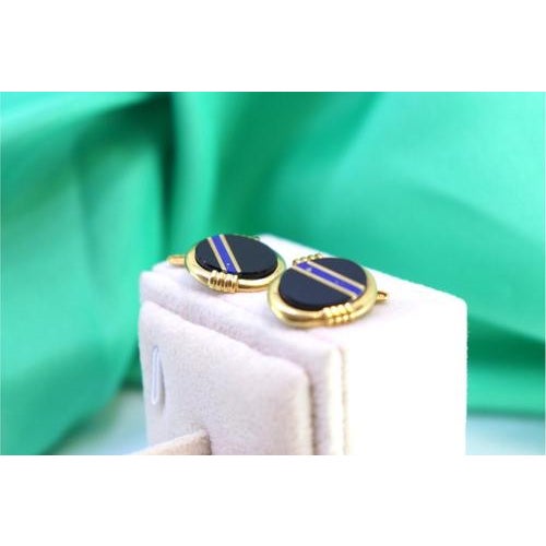 Gold cufflinks with blue stripe reliefs on oval onyx. Metal: Gold. Origin: Portuguese. Brand: Veado. Weight: 6.97 grams....