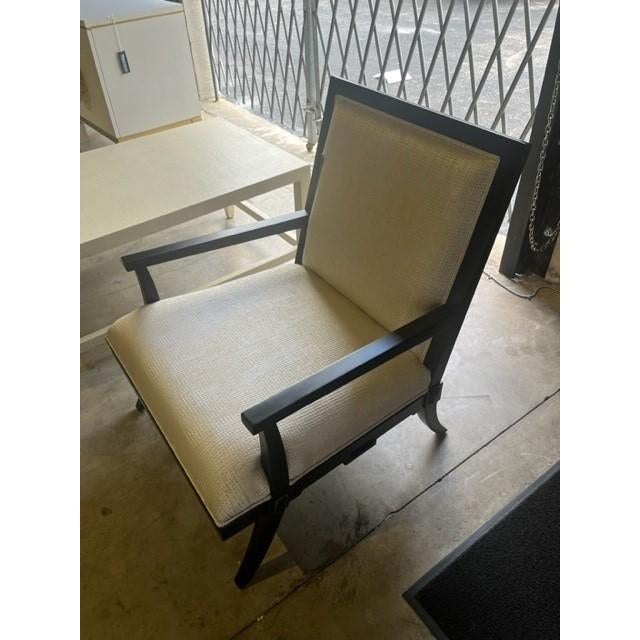 Curry and Company Scarlet lounge chair in Mahogany wood. Gold and white textured fabric. The Scarlett Black Armchair has...