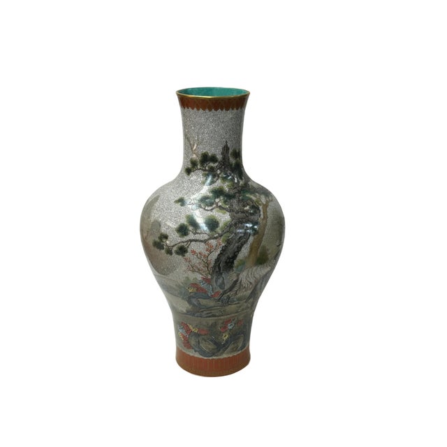 This elegant Chinese porcelain vase features a classic baluster form, characterized by a high, rounded shoulder that...