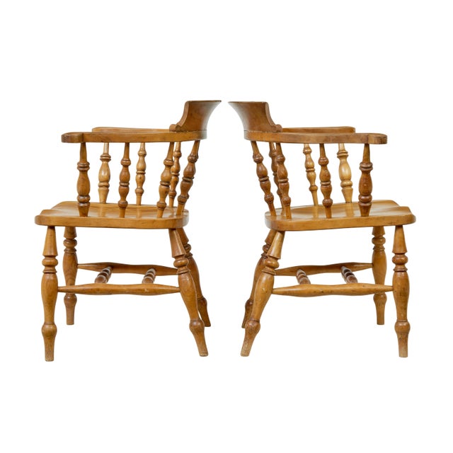 Pair of 19th Century elm elbow chairs circa 1890. Good quality pair of english elm elbow armchairs, each stamped with a...