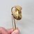 1950s goldtone 3d flower brooch with security clasp. Marked "NAPIER" on the stem. Measures: 3 3/4 inches long by 1 1/8...