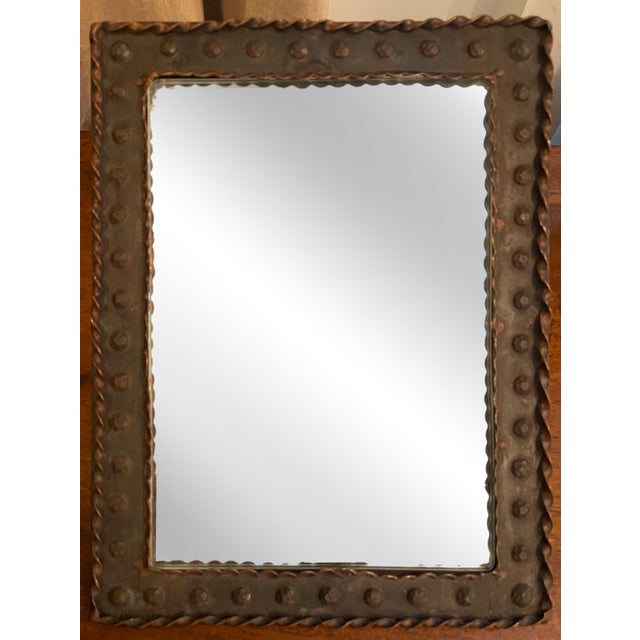 Antique Wrought Iron Framed Mirror A 19th Century Italian Framed Mirror from Florence, Italy decorated with nail heads and...