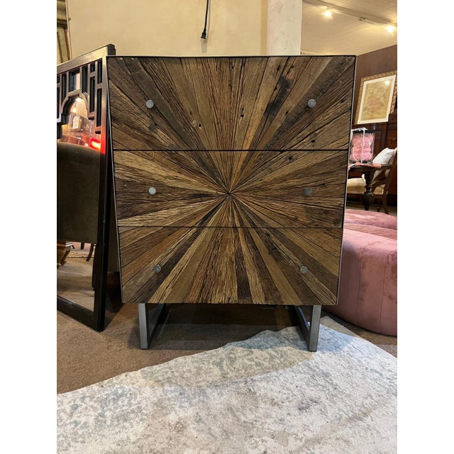 Striking rough-hewn wood cabinet crafted circa 2010s–2020s in the Rustic Modern / Industrial style, featuring a dramatic...