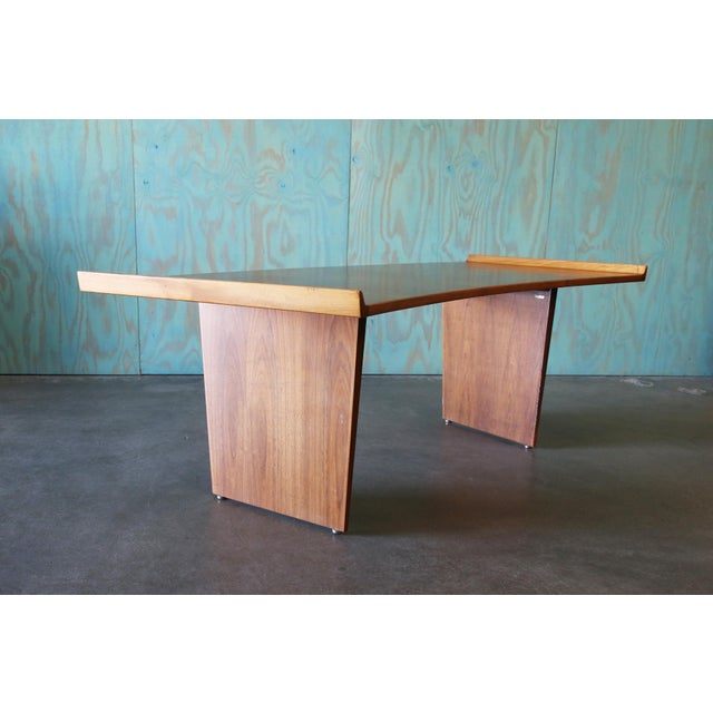 A vintage Advent executive desk designed by Harvey Probber. Featuring a curved boomerang surface with criss crossed...