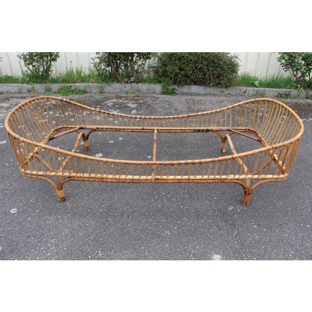 Single rattan bed, vintage 1960 period. Origin Italy. Modernist shape, entirely in rattan. All ligatures are present and...