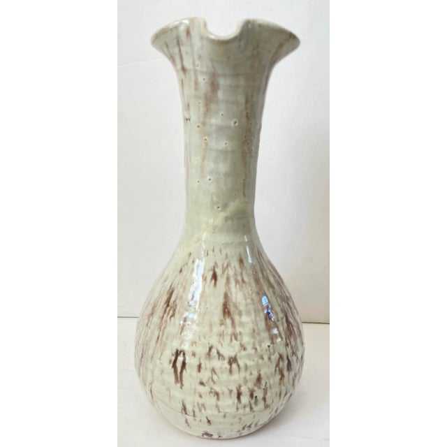 Handsome vintage ceramic pitcher. White glaze with brown undertones. Made by H & R pottery in Sacramento California....