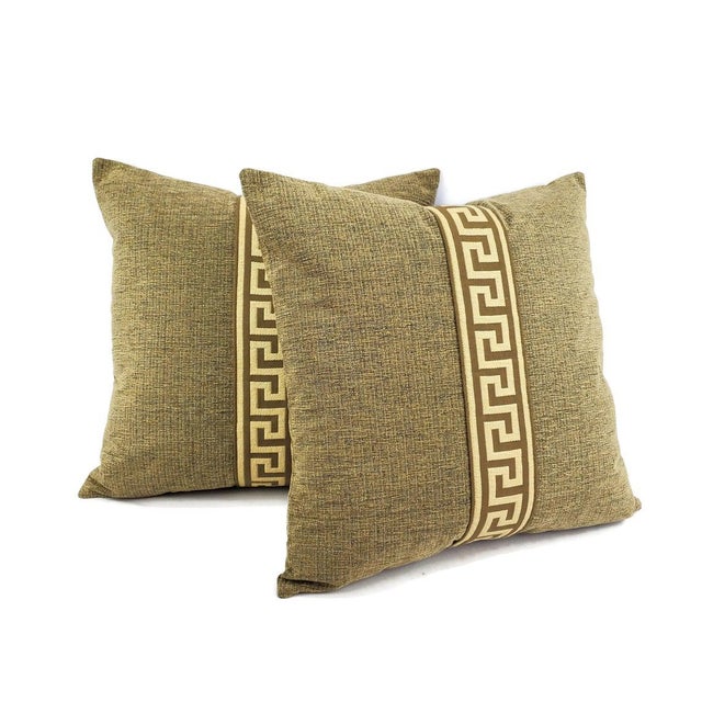 Black and tan textured chenille embellished with a greek key trim pillow cover. A stunning pillow that will compliment...