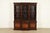 A gorgeous Georgian or Chippendale style breakfront bookcase or dining cabinet By Baker Furniture USA, Circa 1960s Carved...