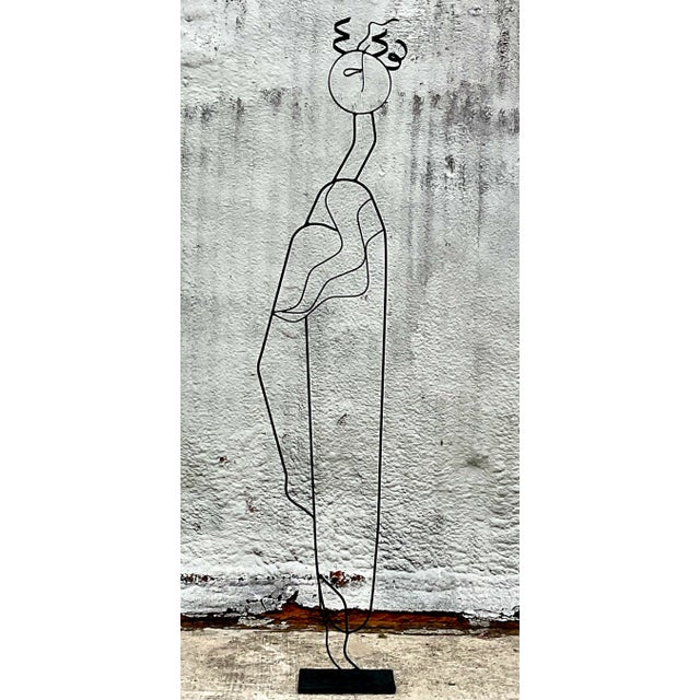 An exceptional monumental Postmodern wrought iron sculpture, standing an impressive 7 feet tall. Masterfully rendered as...
