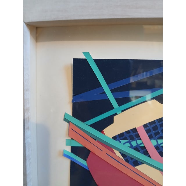 This wonderful artwork is even more fun in person. The vibrantly colored papers just pop out of the frame at you. From her...