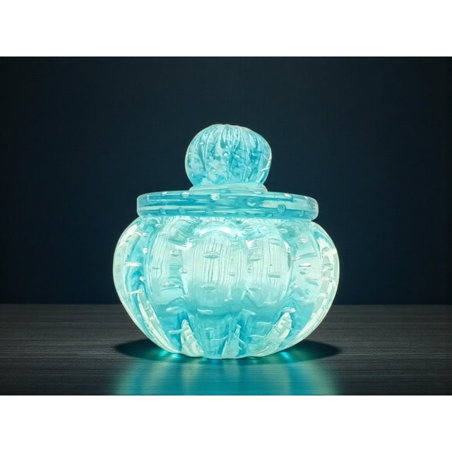 This Murano glass vanity set, featuring a submerged and bullicante design, is vintage from the 1970s. It features an...