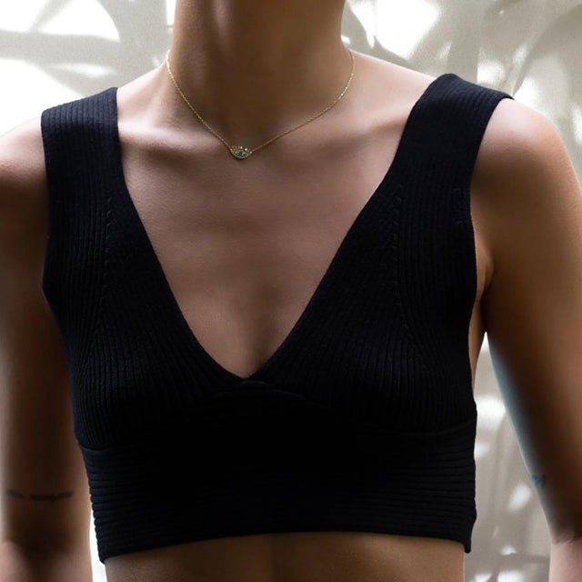 The Diamond Long Lash Evil Eye Necklace is a stunning piece of jewelry that is available in two color options. The first...