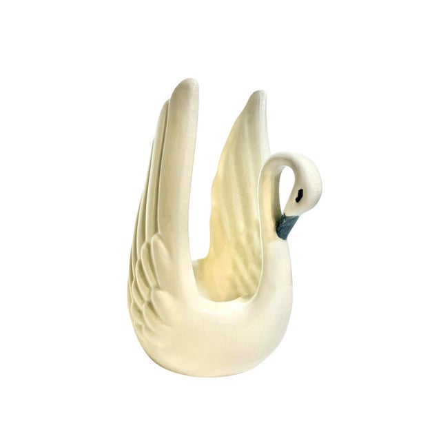 Lovely small size white ceramic swan planter or catchall. Swan has black hand painted eyes and beak.