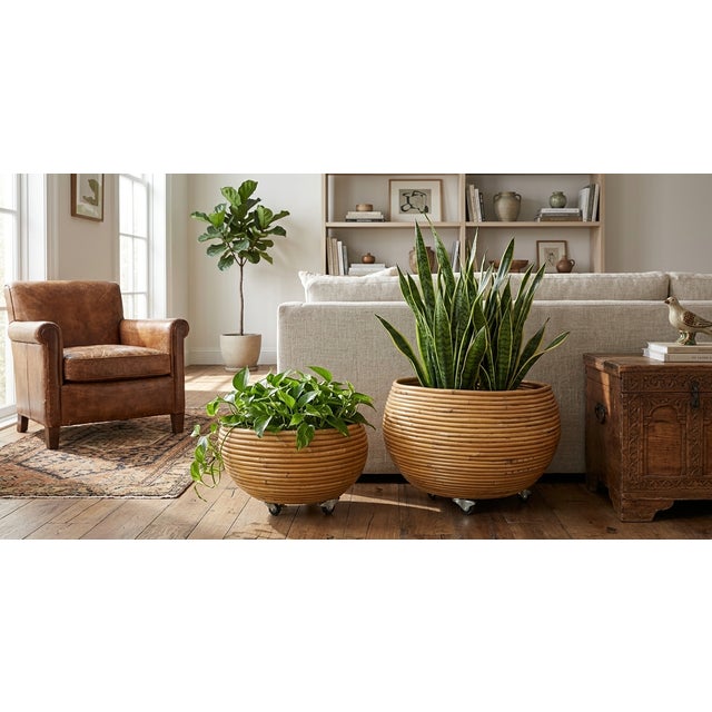 A beautifully crafted pair of vintage globe-form decorative planters featuring tightly wrapped reed construction over...