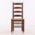 An exceptional set of eight French ladderback dining chairs in solid oak with handwoven rush seats, designed in the rustic...