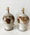 Pair of 1970s hand thrown stoneware lamps with floral pattern. Hand crafted with variations between each lamp. Newly wired...