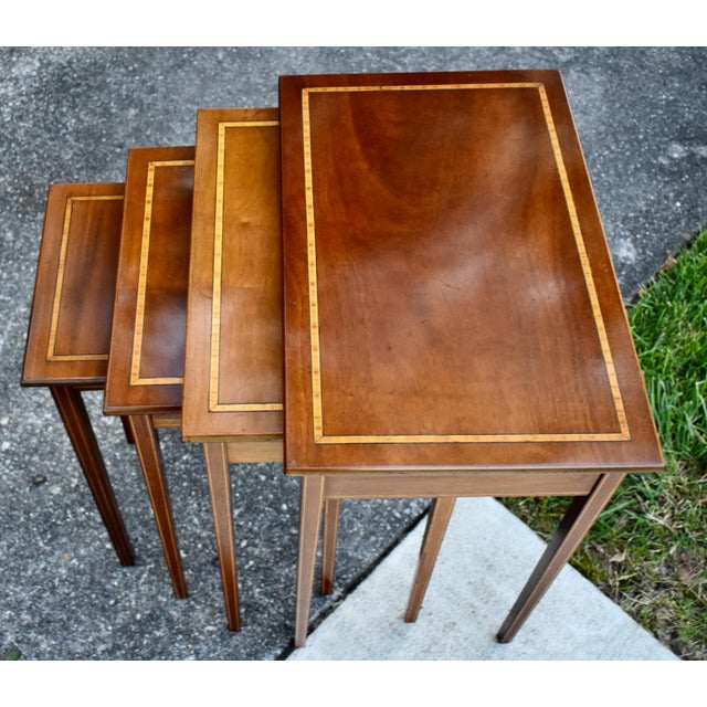 Vintage (Post 1950's) - 1970's 4 Nesting/Stacking Tables have a Traditional Style. The Wood is Mahogany with Inlaid Tops....