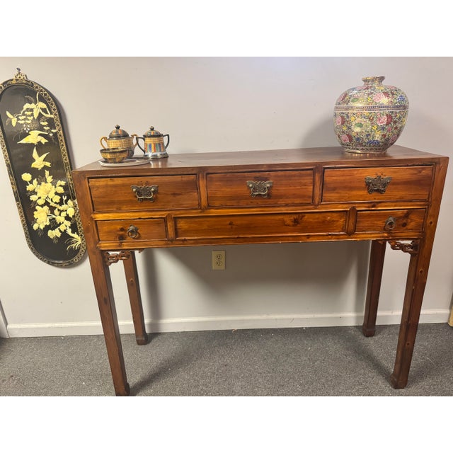 Early 20th century Chinese altar console, circa 1900–1930, constructed in northern softwood (likely pine) with a rich,...