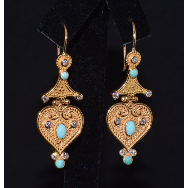 Gorgeous Etruscan / Greek revival dangle earrings. These finely crafted 18K solid gold earrings feature an intricate...