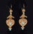 Gorgeous Etruscan / Greek revival dangle earrings. These finely crafted 18K solid gold earrings feature an intricate...