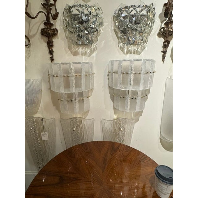This product is a pair of Murano opalescent glass ice block sconces. These sconces are modern and elegant, featuring the...