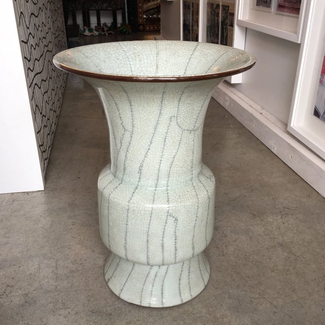 Pale green crackle ceramic umbrella stand. In addition to the overall crackle effect it has long crackle lines giving it...