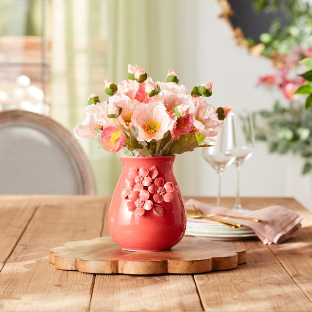 Add a pop of color and texture to your home with the Stoneware Vase with Floral Accent. Featuring vibrant bright pink...
