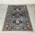 In this listing you will find a beautiful vintage Kazak rug, featuring stunning geometrical patterns on light blue base....